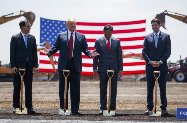 President Donald Trump participates in a Foxconn groundbreaking ceremony, Thursday, June 28, 2018, in Mt. Pleasant, Wis. From left, Gov. Scott Walker, R-Wis., Trump, Foxconn Chairman Terry Gou, and Speaker of the House Rep. Paul Ryan, R-Wis. (AP Photo/Evan Vucci)