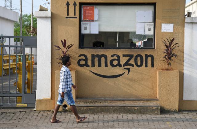 MUMBAI, MAHARASHTRA, INDIA - 2021/10/01: A man walks past the security cabin outside an Amazon warehouse.
Amazon is an e-commerce company selling different variety of goods online to shoppers on their website. (Photo by Ashish Vaishnav/SOPA Images/LightRocket via Getty Images)