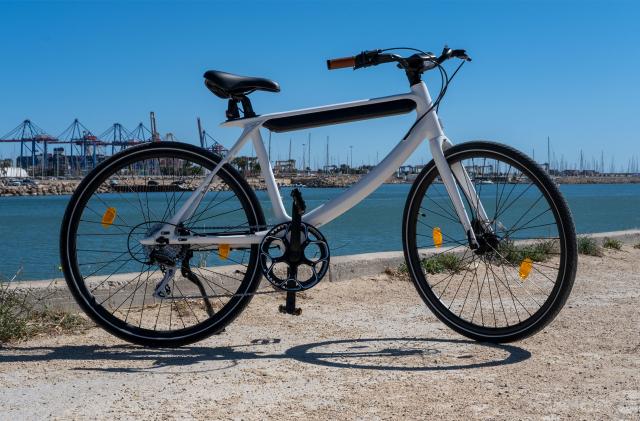 Urtopia's "Chord" e-bike is pictured on a harborside.