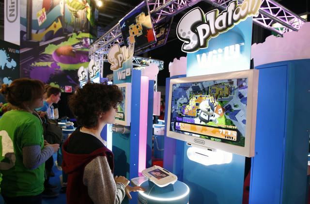 PARIS, FRANCE - OCTOBER 29:  A gamer plays the video game "Splatoon" developed by Nintendo EAD on a games console Nintendo Wii U at Paris Games Week, a trade fair for video games on October 29, 2015 in Paris, France. Paris Games week runs from October 28 until November 1, 2015.  (Photo by Chesnot/Getty Images)