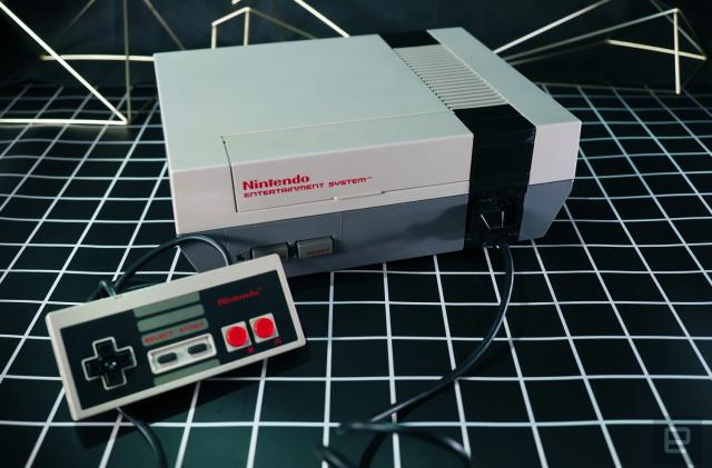 A Nintendo NES console pictured with a controller.