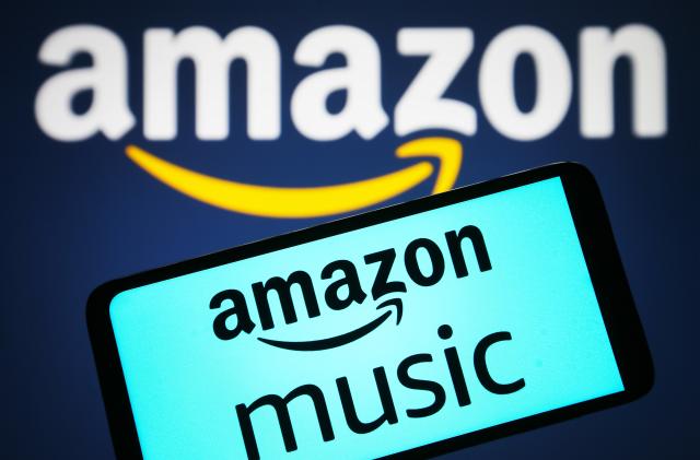 UKRAINE - 2023/04/05: In this photo illustration, an Amazon Music logo is seen on a smartphone and Amazon logo in the background. (Photo Illustration by Pavlo Gonchar/SOPA Images/LightRocket via Getty Images)
