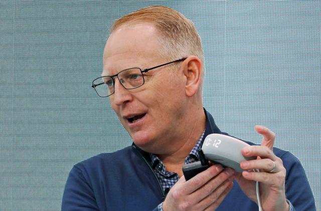 Dave Limp, senior vice president for Amazon devices & services, holds a new Echo Dot with Clock device as he speaks Wednesday, Sept. 25, 2019, at an event in Seattle to unveil new products that work with the company's Alexa smart devices line.