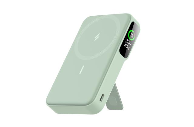 A light moss green charger stands using a kickstand leg on its rear, showing the magnetic front panel and a small display along the side. 