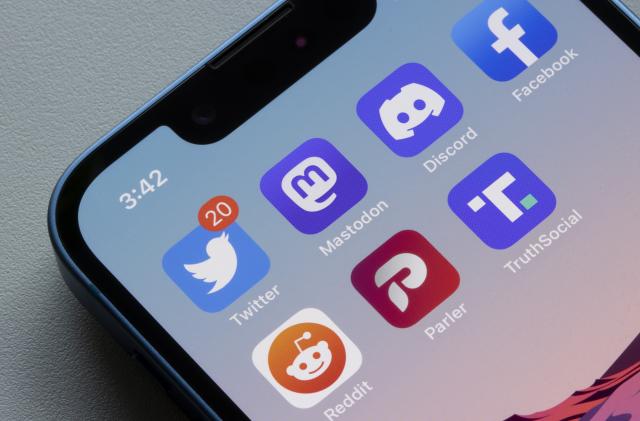 Portland, OR, USA - Nov 8, 2022: App icons of Twitter and some of its alternatives, including Mastodon, Discord, Facebook, Reddit, Parler, and Truth Social, are seen on an iPhone. Mastodon, a decentralized social media platform, is rapidly gaining users after Elon Musk's Twitter takeover.