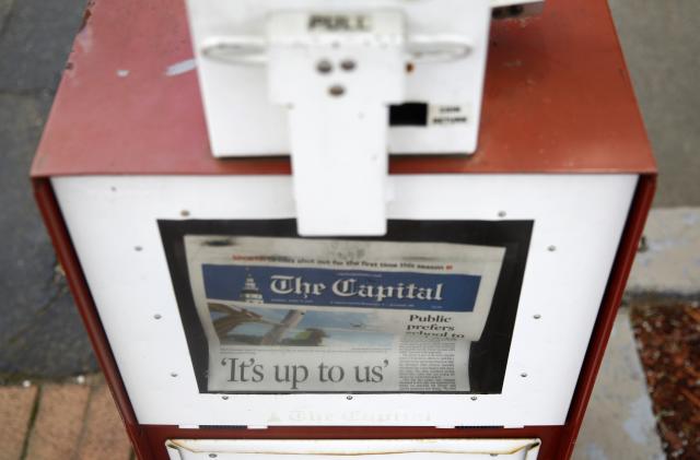 A copy of the day's Capital Gazette newspaper rests in a newsstand, Monday, April 15, 2019, in Annapolis, Md. The Pulitzer Prize board awarded the Capital Gazette a special citation Monday for their response to a 2018 shooting that left five employees dead. (AP Photo/Patrick Semansky)