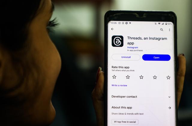 A girl looks at a Threads app at the Play Store on July 7, 2023, in Colombo, Sri Lanka. (Photo by Thilina Kaluthotage/NurPhoto via Getty Images)