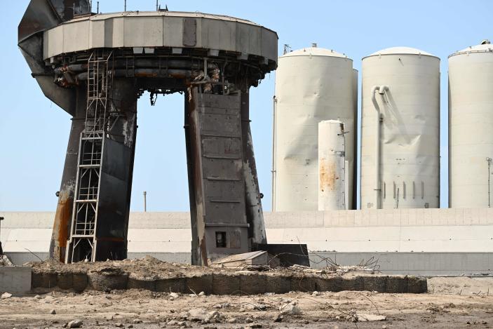 Debris litters the launch pad and dmaged tanks (R rear) on April 22, 2023, after the SpaceX Starship lifted off on April 20 for a flight test from Starbase in Boca Chica, Texas. - The rocket successfully blasted and the Starship capsule had been scheduled to separate from the first-stage rocket booster three minutes into the flight but separation failed to occur and the rocket blew up. (Photo by Patrick T. Fallon / AFP) (Photo by PATRICK T. FALLON/AFP via Getty Images)